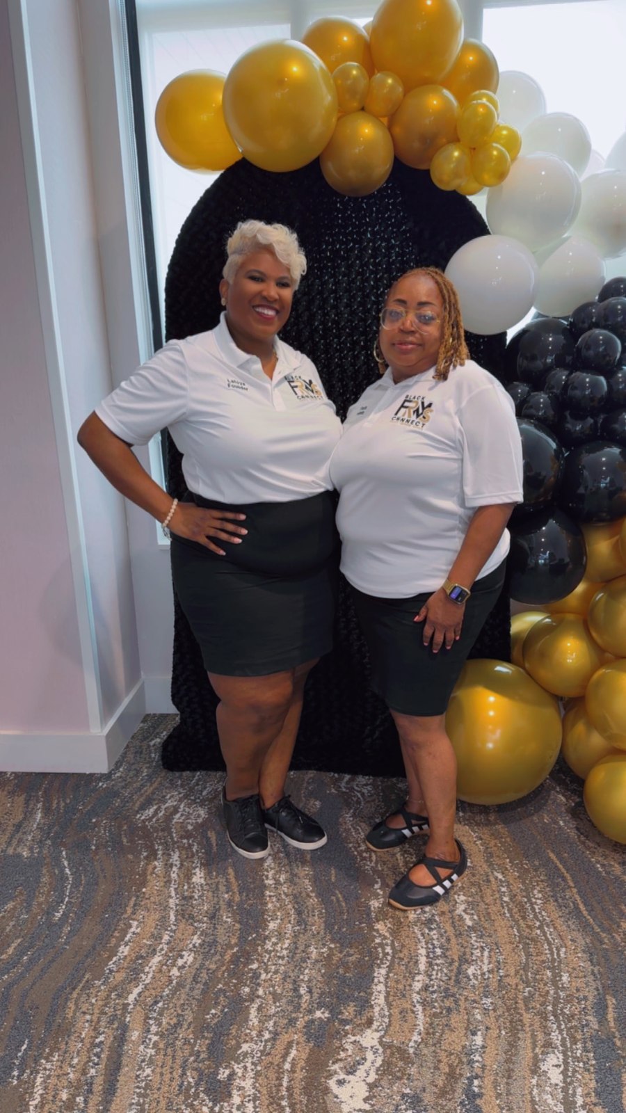Toya and a member wearing white Black FRMs Connect polos