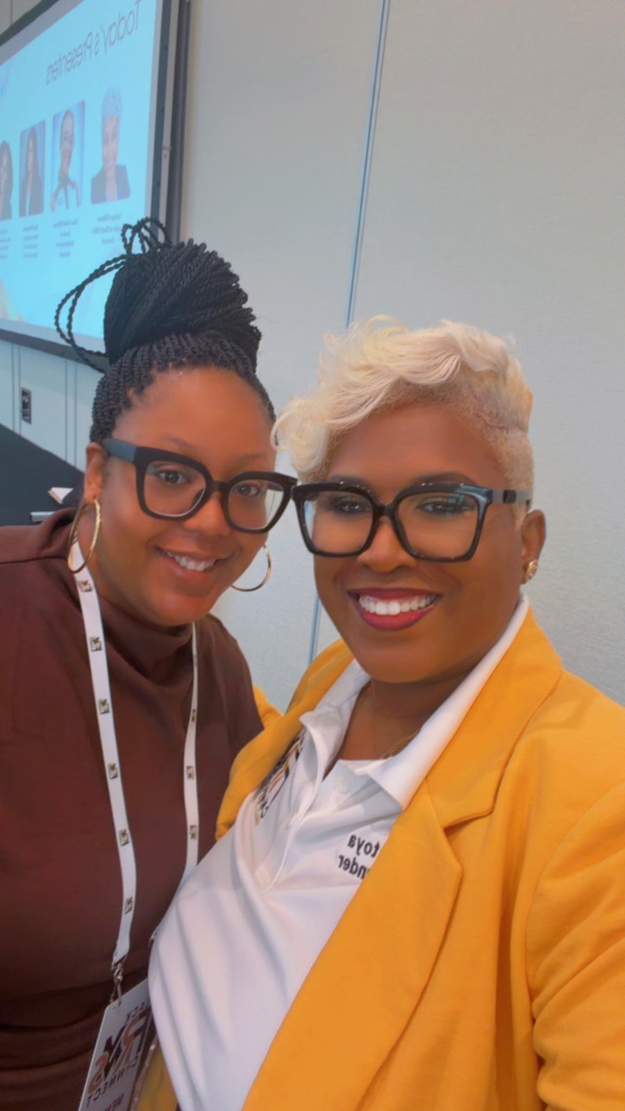 Toya and a community member smiling in a close-up selfie